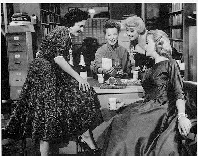 Katharine Hepburn (center) as Bunny Watson, reference librarian, in the 1957 film Desk Set